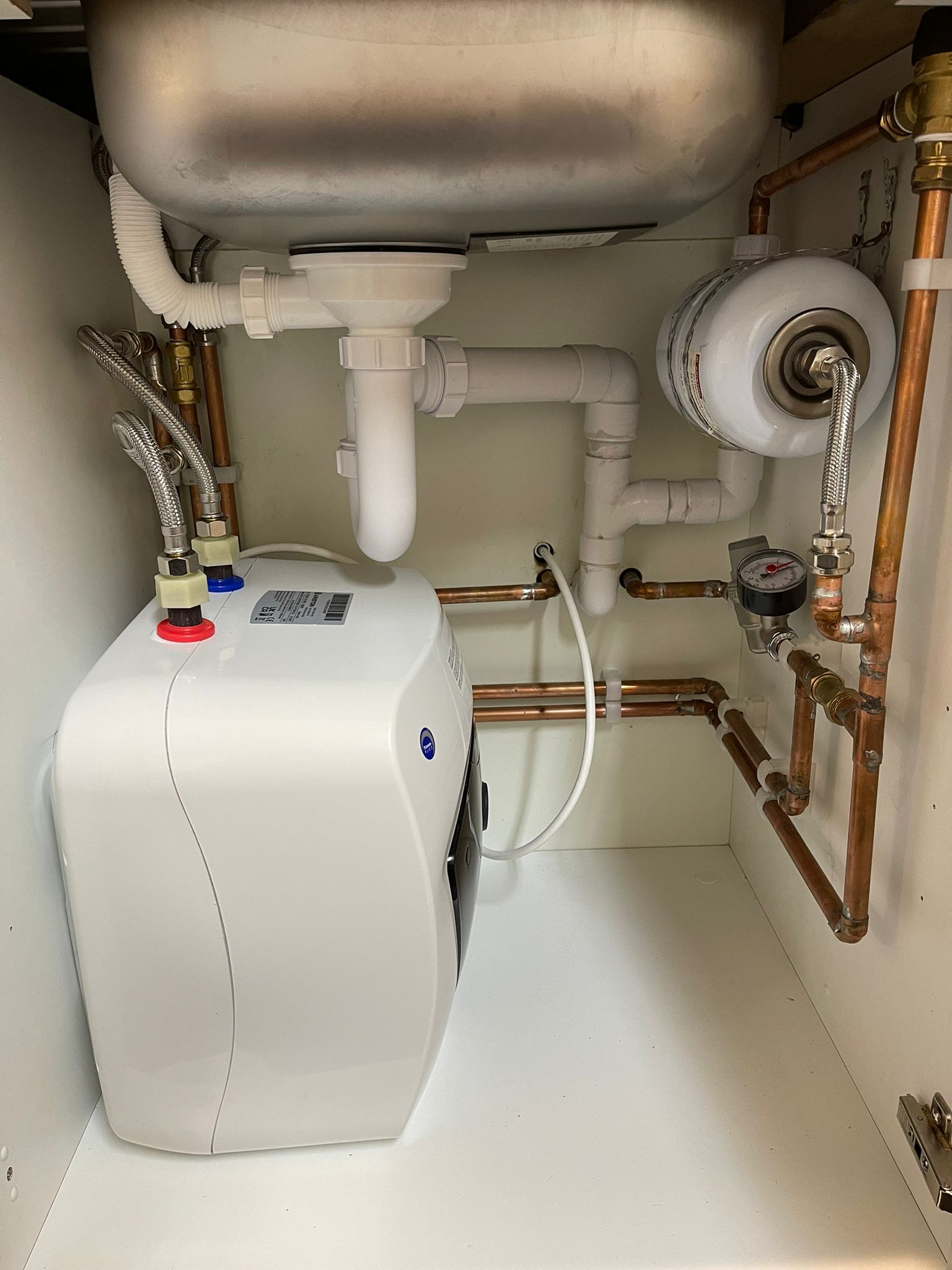 Electric Unvented hot water heater fitted to external out building